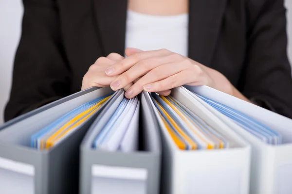 depositphotos_26406703-stock-photo-businesswoman-with-binders.jpg